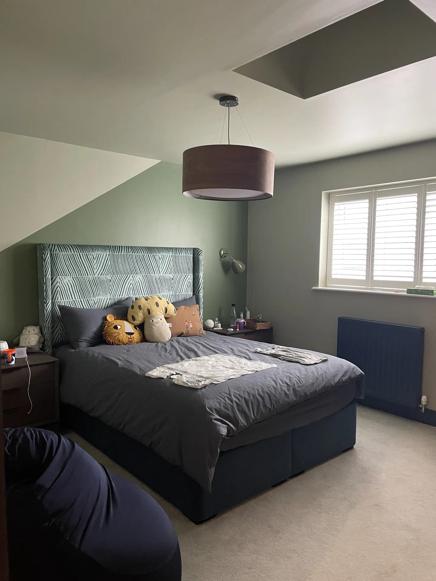 Finchley bedroom feature walls with deep paint colour, crisp geometry and hand-finished edges opening view